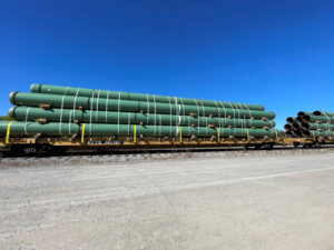 Line pipe is loaded on TerraTech Services' trucks, ready to be delivered 