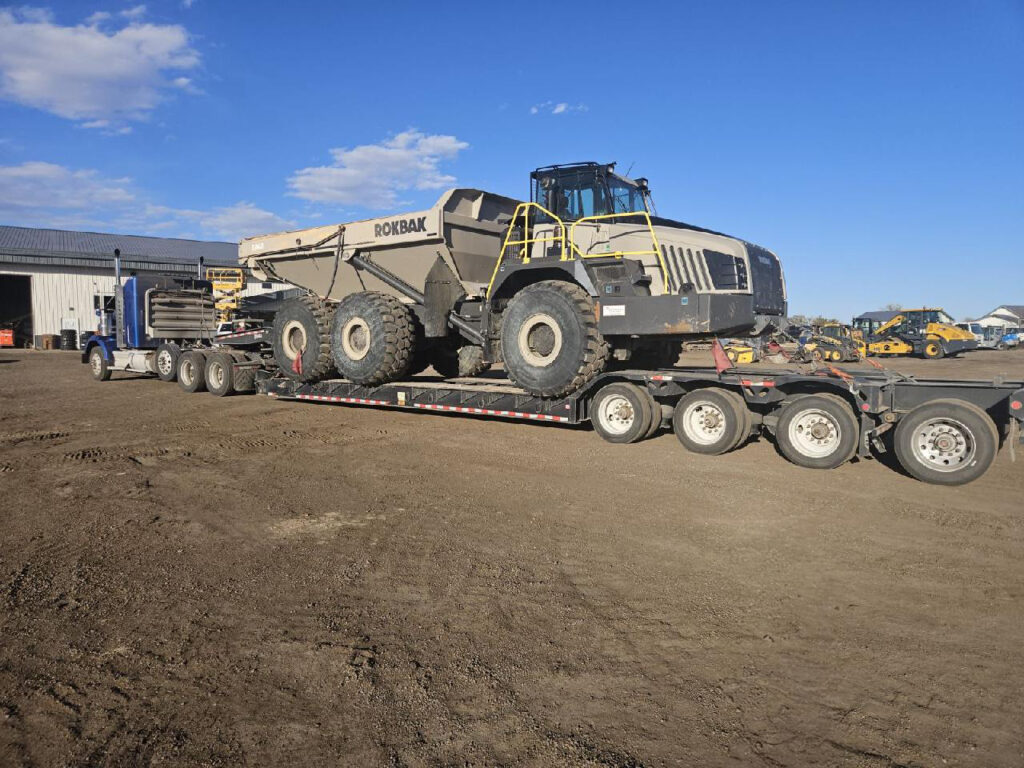 TerraTech's heavy haul servicing truck carries a massive rock loader. 